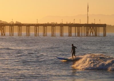 ventura pier surfer at golden hour