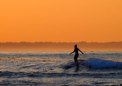 silhouette morning girl surfer